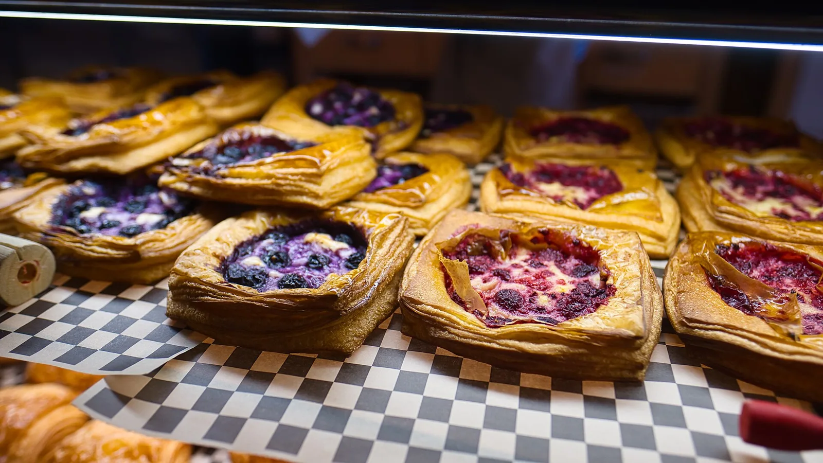 Pastries on display in a bakery case. The photo was not taken in Boynton Beach.