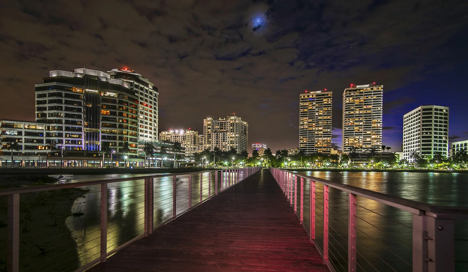 The West Palm Beach waterfront at night, seen from a pier on the Intracoastal Waterway, where the city's midnight fireworks are held.