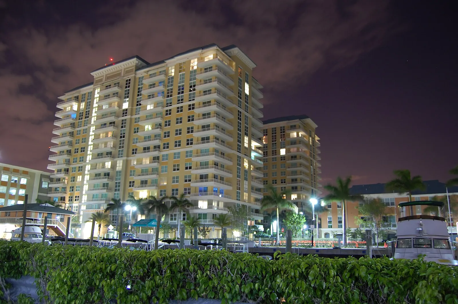 The Marina Village condominium towers on the Boynton Beach waterfront at night.