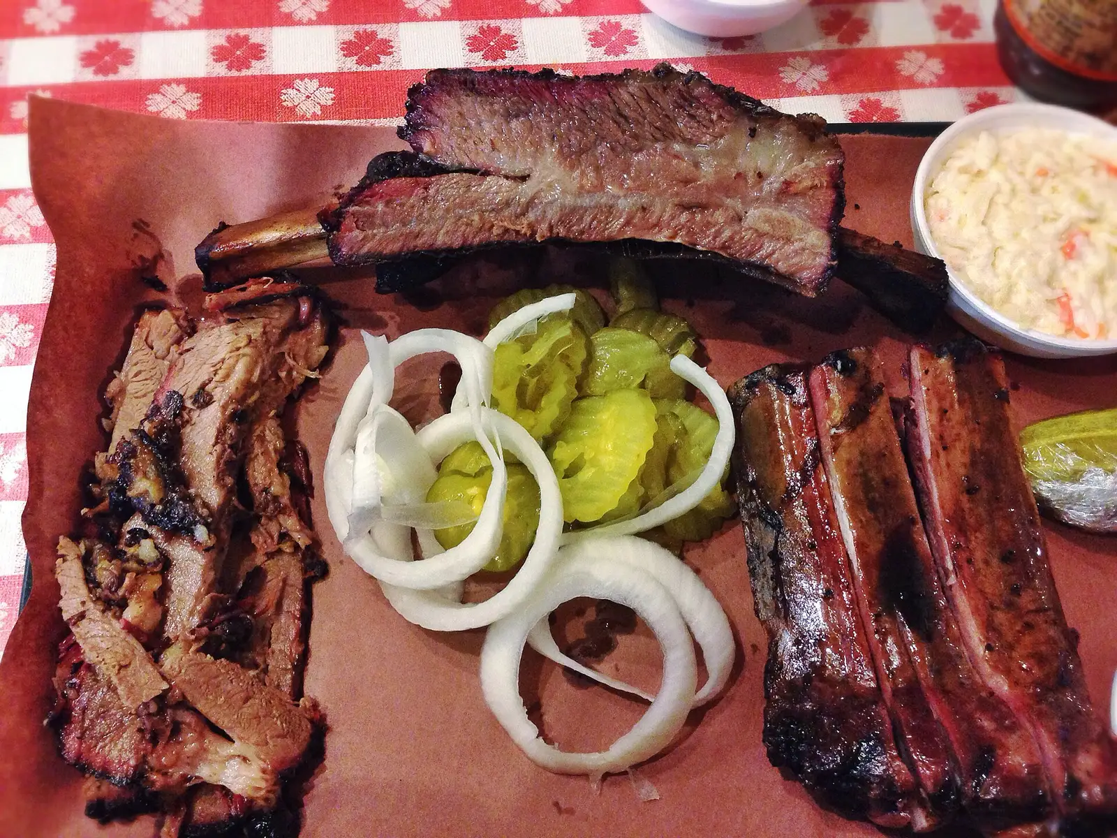 A barbecue plate of brisket, sausage and sides. The photo was not taken at a Boynton Beach restaurant.