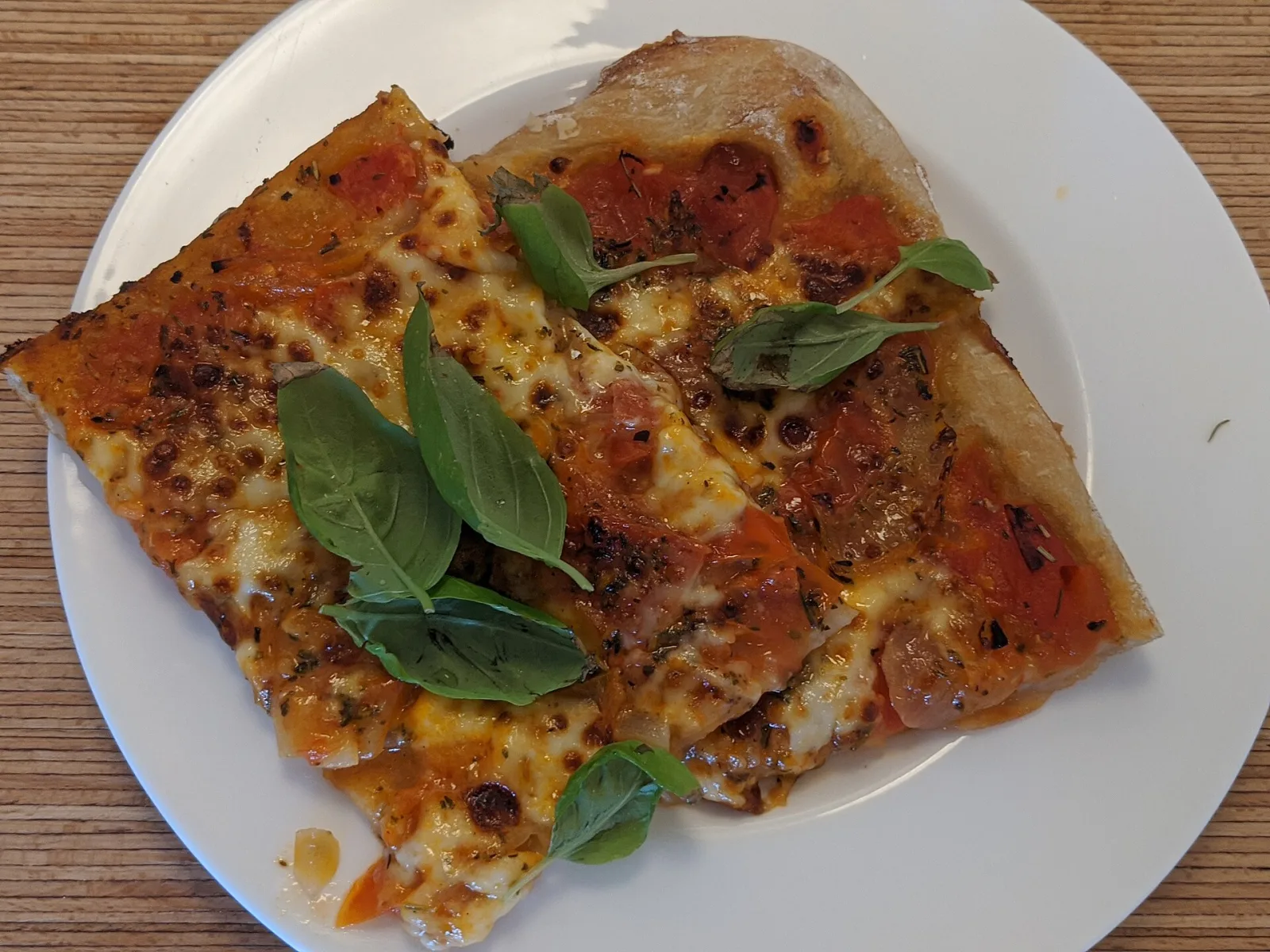 A margherita pizza on a plate. The photo was not taken at a Boynton Beach restaurant.